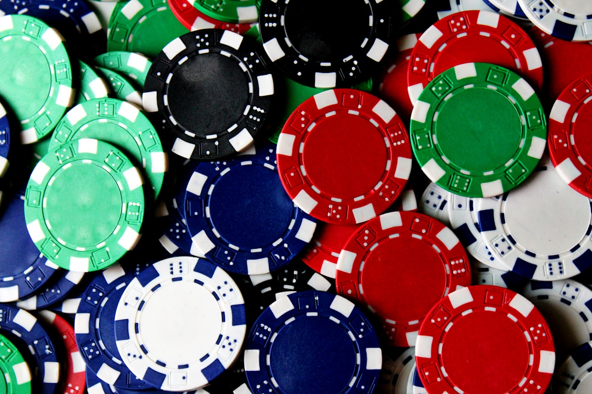 Scattered poker chips representing gambling industry money